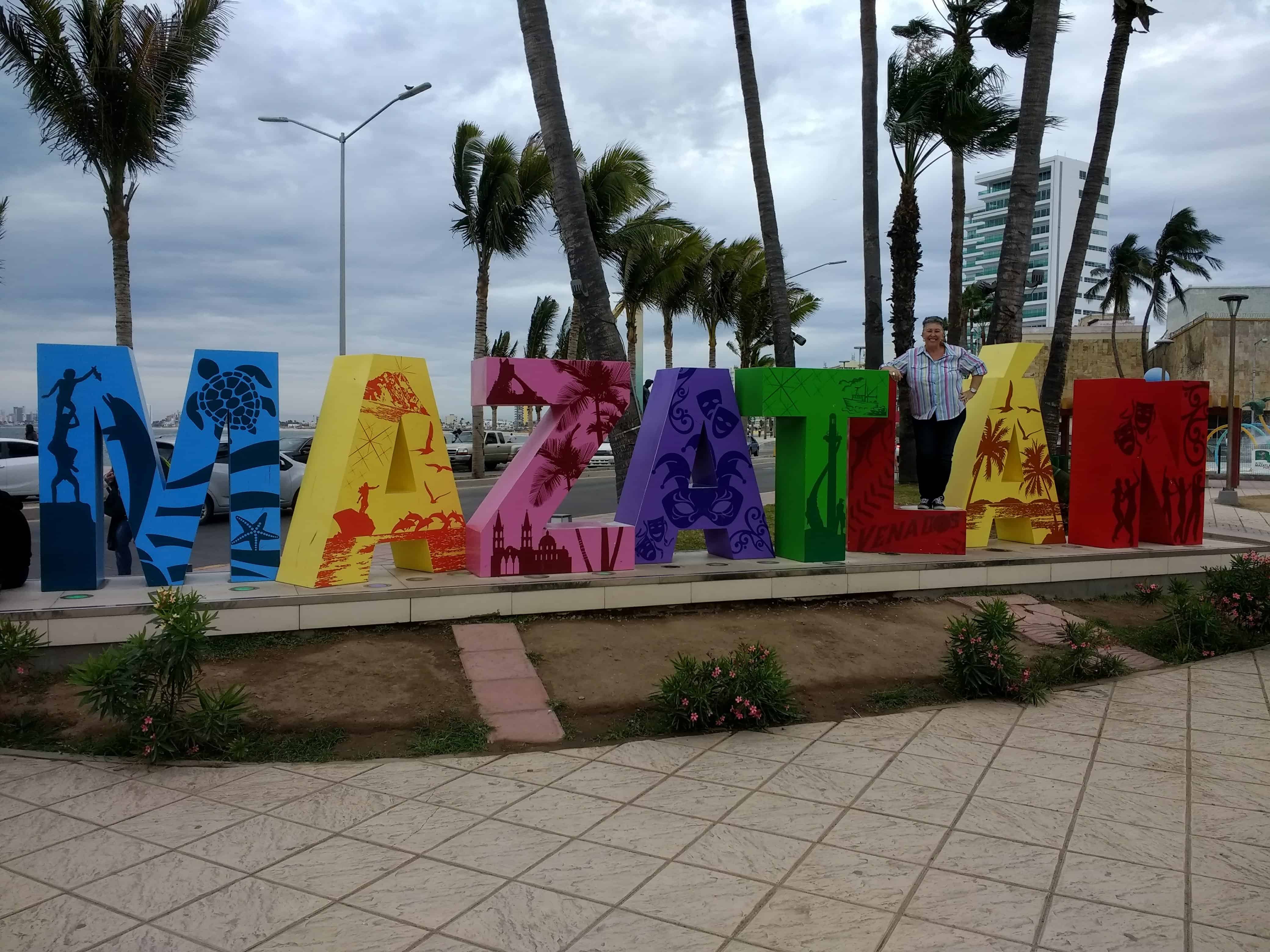 Ana posing with Mazatlan word sculpture